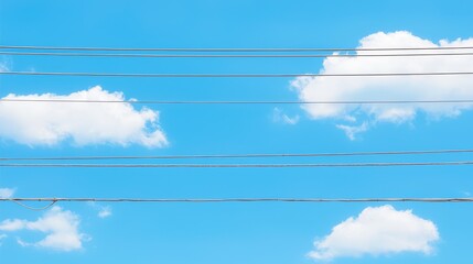 Fototapeta premium Clear blue sky with fluffy clouds and power lines creating a serene atmosphere.