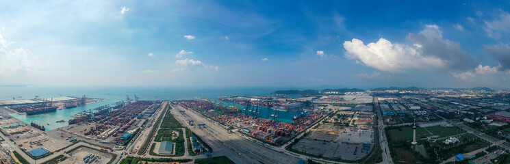 Fototapeta premium Aerial view of business logistic import-export transport sea freight transportation. Network logistics partnership connection busiest container ports. Container ships loading and unloading background.