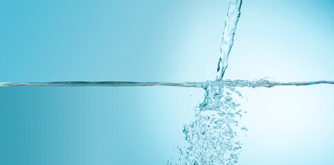 Front view of water jet filling a water tank with bubbles