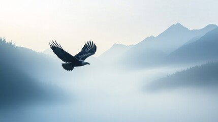 Fototapeta premium Majestic Eagle Soaring Above Misty Mountains