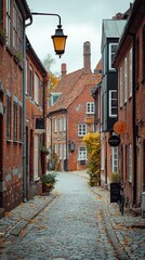 Cobblestone street lined with brick buildings in an autumn European town scene