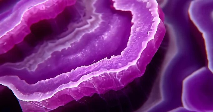 Close-up view of layers in a purple agate slice. Possible use Nature, minerals, geology, education