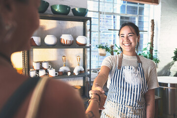 People, handshake and agreement in pottery business, clay store and service deal with customer....