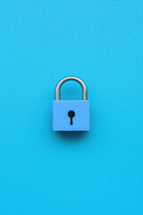 Fototapeta premium Family Protection and Insurance Concept for Financial Security, Blue padlock on blue background symbolizes security