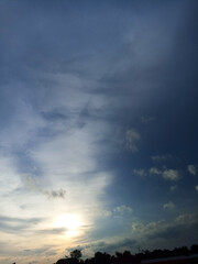 the sun sets in the afternoon when there are many people in the field