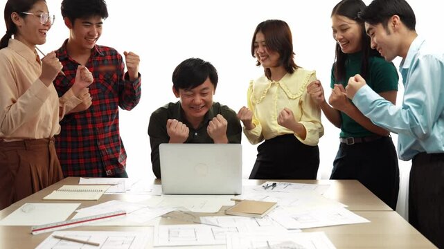 Architect and safety engineer celebrate success design building blueprint project on laptop with architectural document and measurement tool scatter around at modern office. Closeup. Delineation.