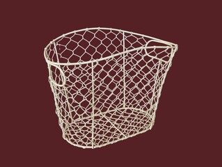 Obraz premium The dark red background in the picture is a white wire mesh basket with a beautiful white honeycomb pattern that can be used to hold various things. It has two handles on each side and is beautifully 