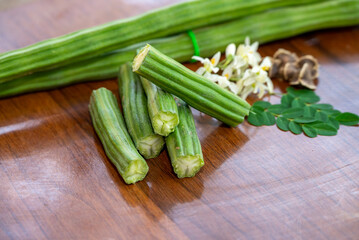 Moringa oleifera, Moringa leaves, Moringa flower, Moringa seed on wood background