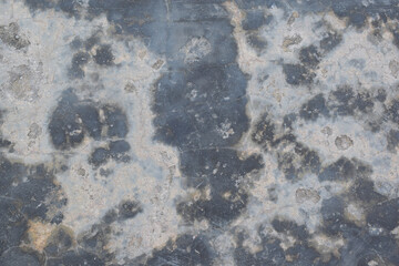 Gray cement floor textured with cracks. Cracked concrete floor texture background. Abstract concept.