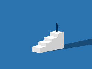 Businessman standing on the top of the ladder looking for new success
