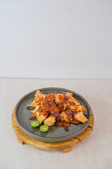 Delicious Crispy Batagor Drenched In Thick Peanut Sauce And Sweet Soy, Served Fresh And Hot With Calamansi On A Plate For An Irresistible Meal.