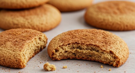 Fototapeta premium Delicious half-bitten cinnamon cookies with tantalizing spice sprinkle