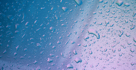abstract pearl background with texture of rain drops on a metal surface close-up