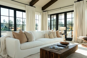 Fototapeta premium Stylish contemporary living space featuring a plush white couch, clean geometric furniture, warm wooden accents, and soft flowing curtains