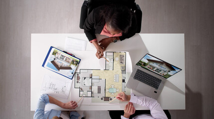 Real Estate Agent Discussing House Plan