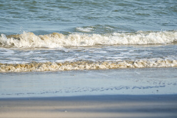 The sea water on the beach is a wave of various forms for background.