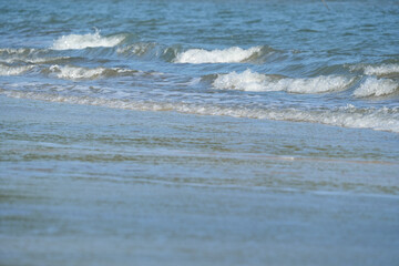 The sea water on the beach is a wave of various forms for background.