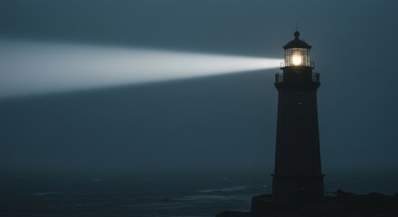 A towering lighthouse illuminates the dark ocean at night with its guiding beacon.
