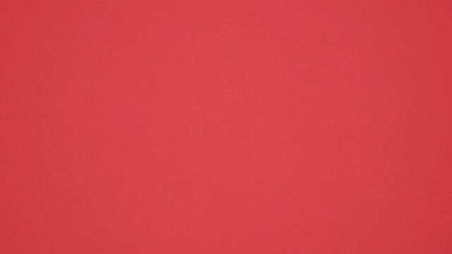 Red Paper sheet tearing from the center opening green screen background. Chroma key, screen transition. Stop motion animation.
