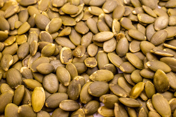 dry pumpkin seeds close-up background