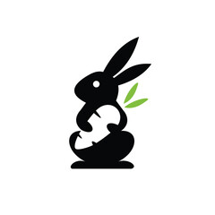 silhouette rabbit logo hugging carrot