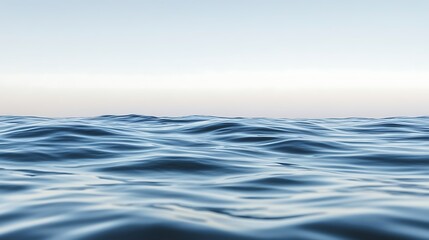 Fototapeta premium A tranquil scene depicts calm water with the soft sky above it