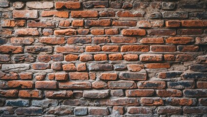 Obraz premium Red and gray textured brick wall background with uneven surface and various brick sizes