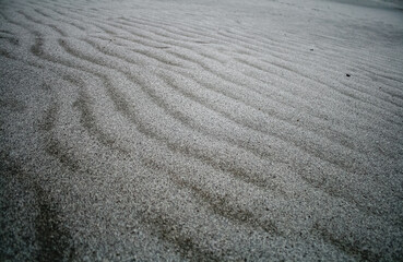 Abstract Close-Up of Textured Sand with Fine Ripples in Gray Tones
