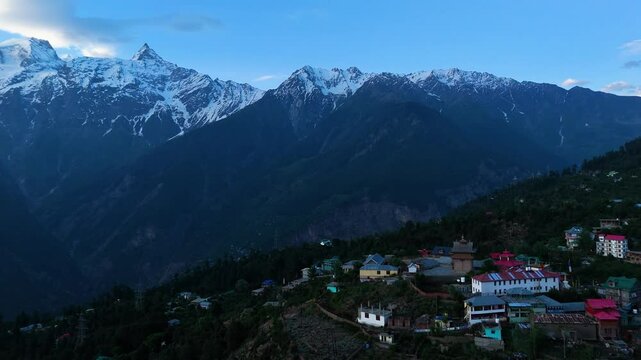 Aerial drone shot showing the changing hues of Kalpa&rsquo;s landscape with Kinner Kailash at sunset.