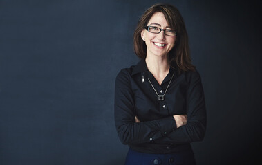 Portrait, arms crossed and business woman in studio, compliance officer or policy advisor. Glasses,...