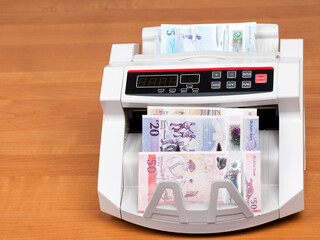 Northern Ireland’s money in a counting machine