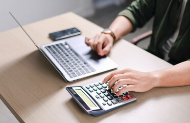 Businessman Calculate Budget, Report and Financial Analysis Calculator of Business, Calculate Tax, Income and Expense.