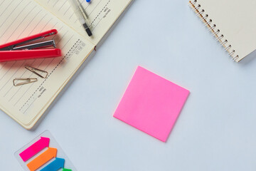 Desk Workspace Featuring Stationery, Notepads, and Sticky Notes for Organization and Planning