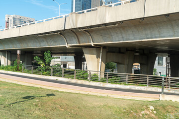 Concrete structure and asphalt road space under the overpass in the city