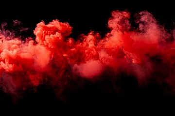 A dramatic burst of red smoke expands against a solid black background, creating a striking contrast. The swirling, cloud like formation captures the dynamic motion and intensity of the explosion.