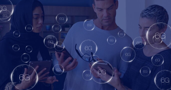 Image of circles with 6g text over diverse colleagues using tablets