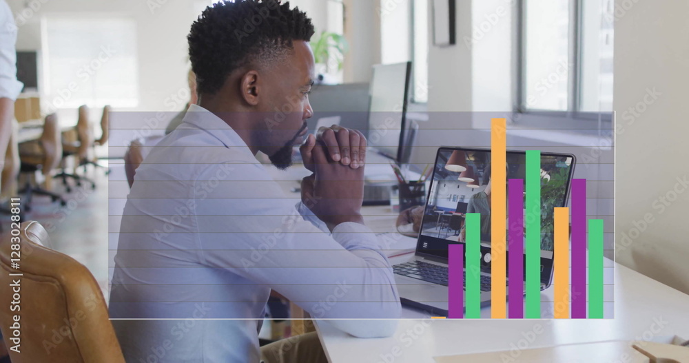 Poster image of digital data processing over afrcian american businessman on laptop image call
