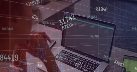 Image of financial data processing over african american businesswoman using laptop