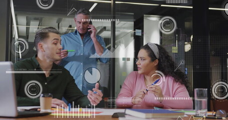 Image of data processing and diagrams over diverse colleagues discussing work in office