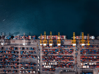 container ship and commercial port in deep sea load and unloading cargo from container ship import...