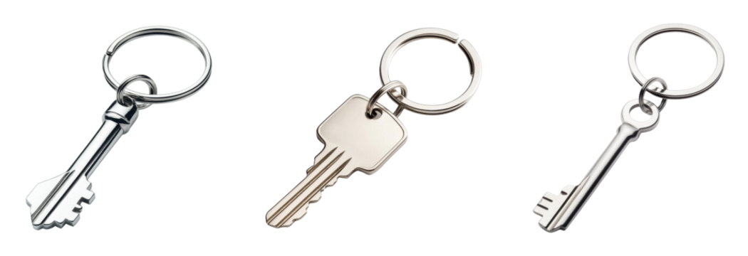 Stylish metal keys on keychains against a black background