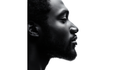 Profile view of a man against a white backdrop