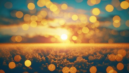 Twilight sunset with a blurred golden sky and shimmering bokeh effects creating a serene and atmospheric background scene.