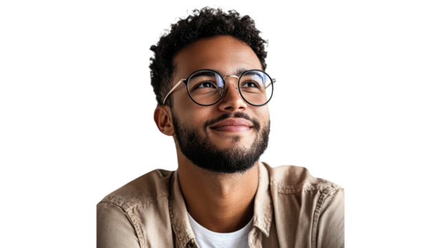 Man with glasses smiles thoughtfully indoors