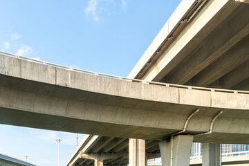 Elevated expressway during a sunny day. highway overpass against blue sky