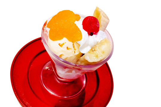 Top view of parfe Fruit ice cream on red plate, focus selective