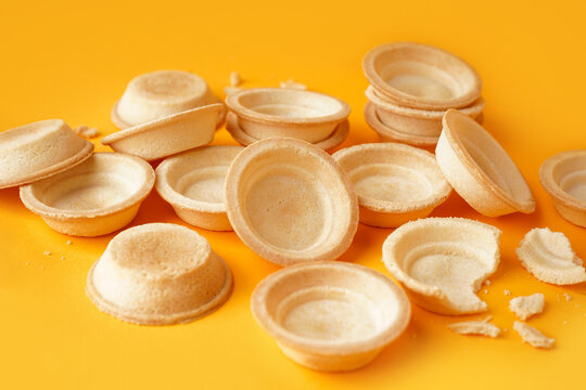 Homemade tartlets on yellow background