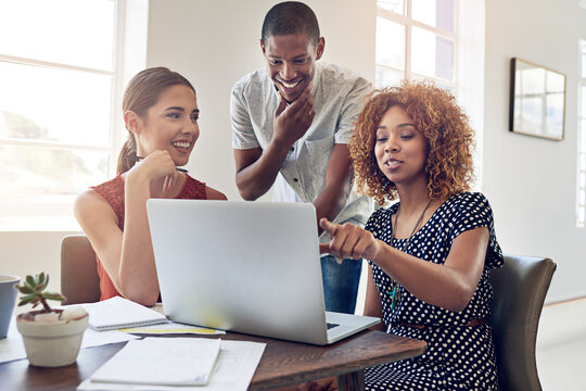 Graphic designer, laptop and happy people in startup for meeting, development and collaboration. Brainstorming, smile and creative strategist in workplace for project, planning or teamwork in office