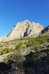 The mountain panorama opening from the hiking path to Puig Ca Campana, Finestrat, Spain  