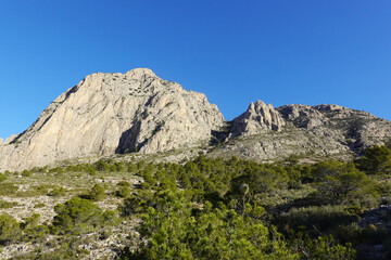 The mountain panorama opening from the hiking path to Puig Ca Campana, Finestrat, Spain  